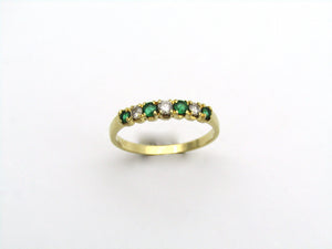 18K gold emerald and diamond ring.