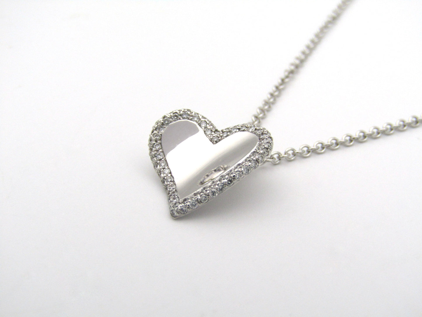 18K gold diamond heart pendant.