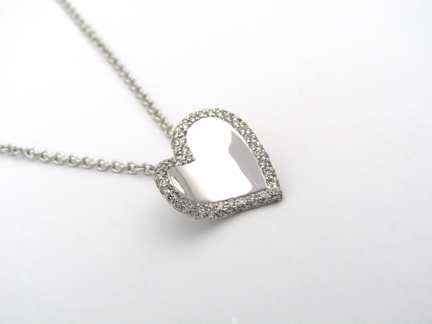 18K gold diamond heart pendant.