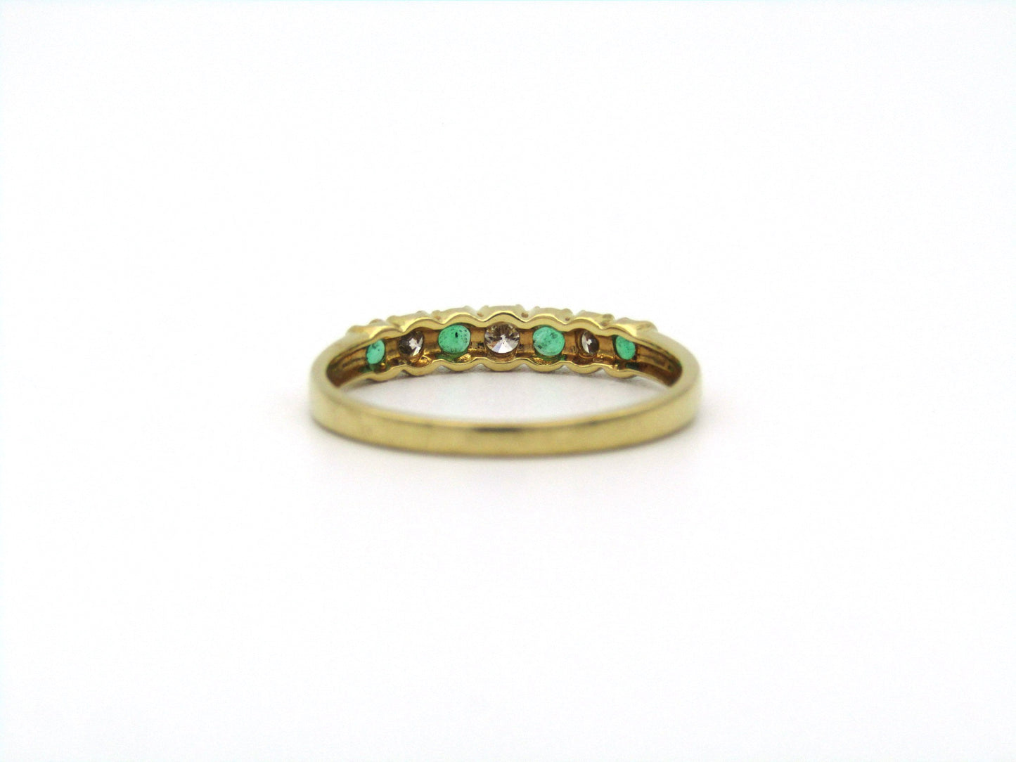 18K gold emerald and diamond ring.