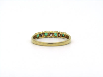 18K gold emerald and diamond ring.