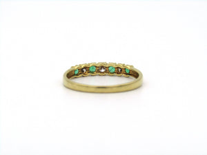 18K gold emerald and diamond ring.