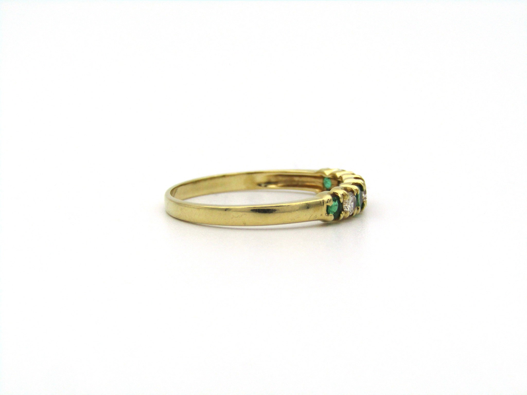 18K gold emerald and diamond ring.