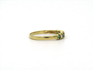 18K gold emerald and diamond ring.