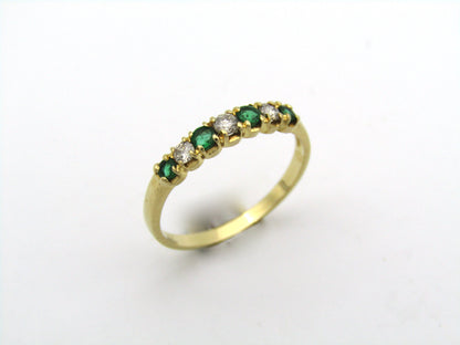 18K gold emerald and diamond ring.