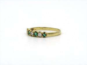 18K gold emerald and diamond ring.