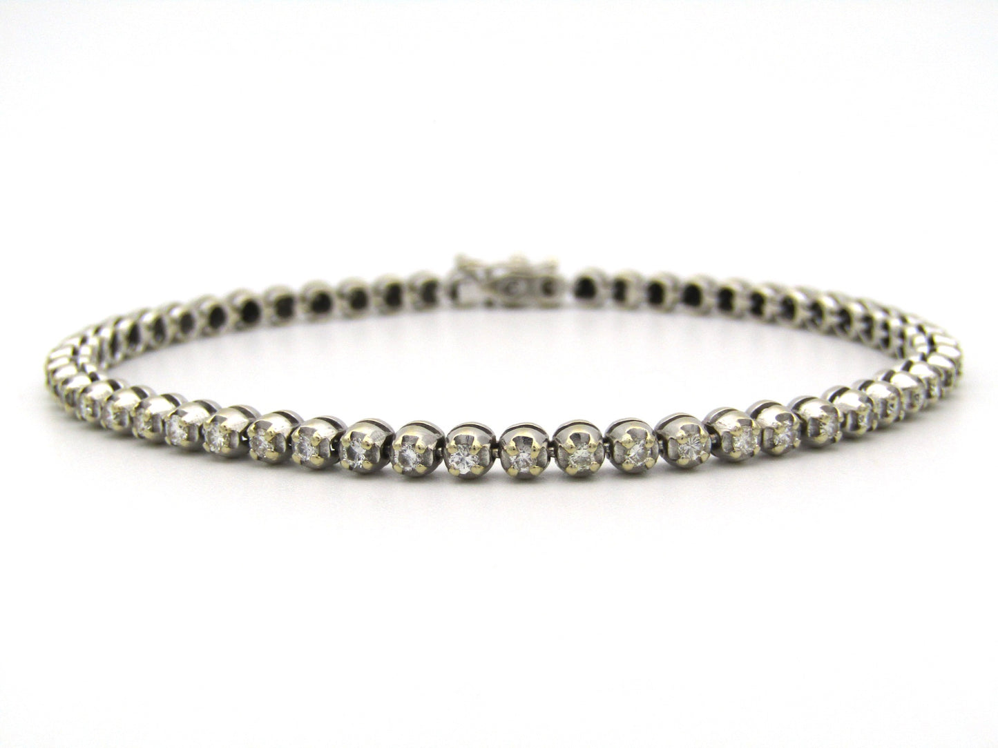 18K gold diamond tennis bracelet.