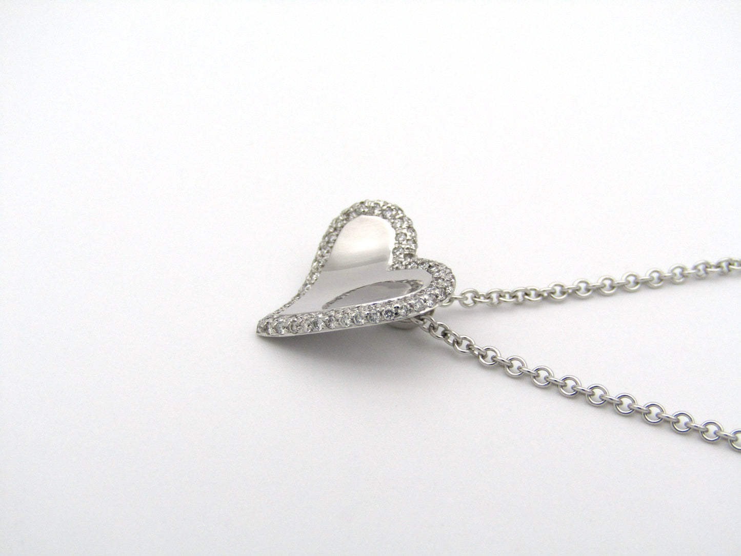 18K gold diamond heart pendant.