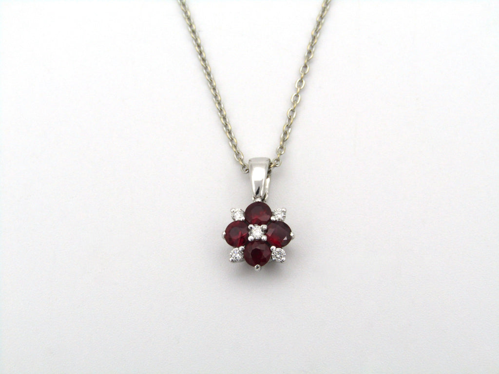 18K gold ruby and diamond blossom pendant by Browns.