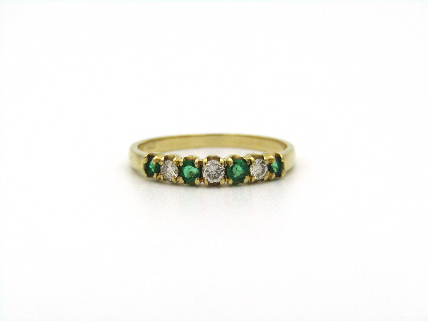 18K gold emerald and diamond ring.