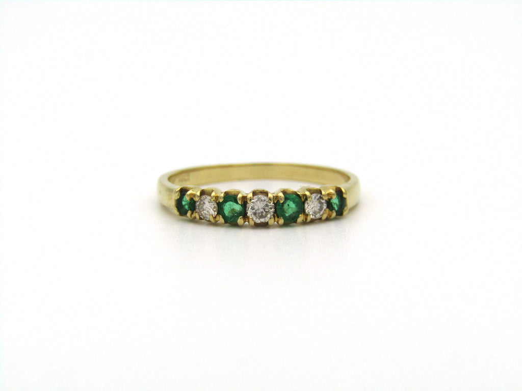 18K gold emerald and diamond ring.
