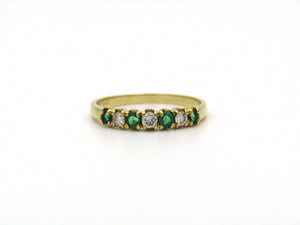 18K gold emerald and diamond ring.