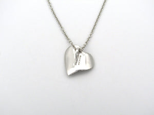 18K gold diamond heart pendant.