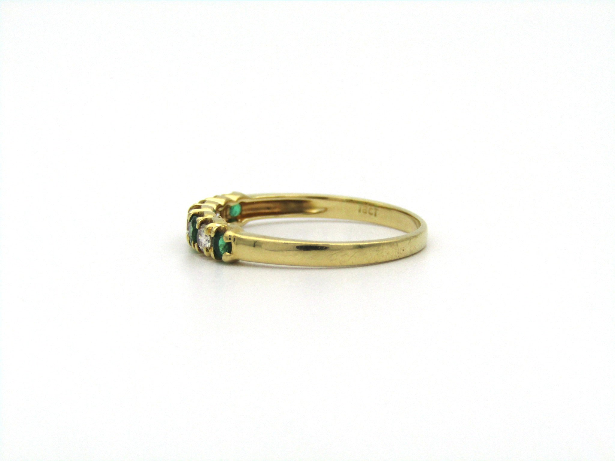 18K gold emerald and diamond ring.