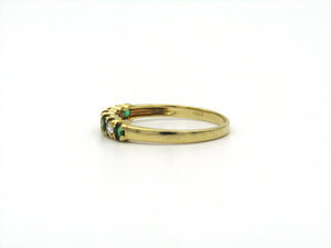 18K gold emerald and diamond ring.