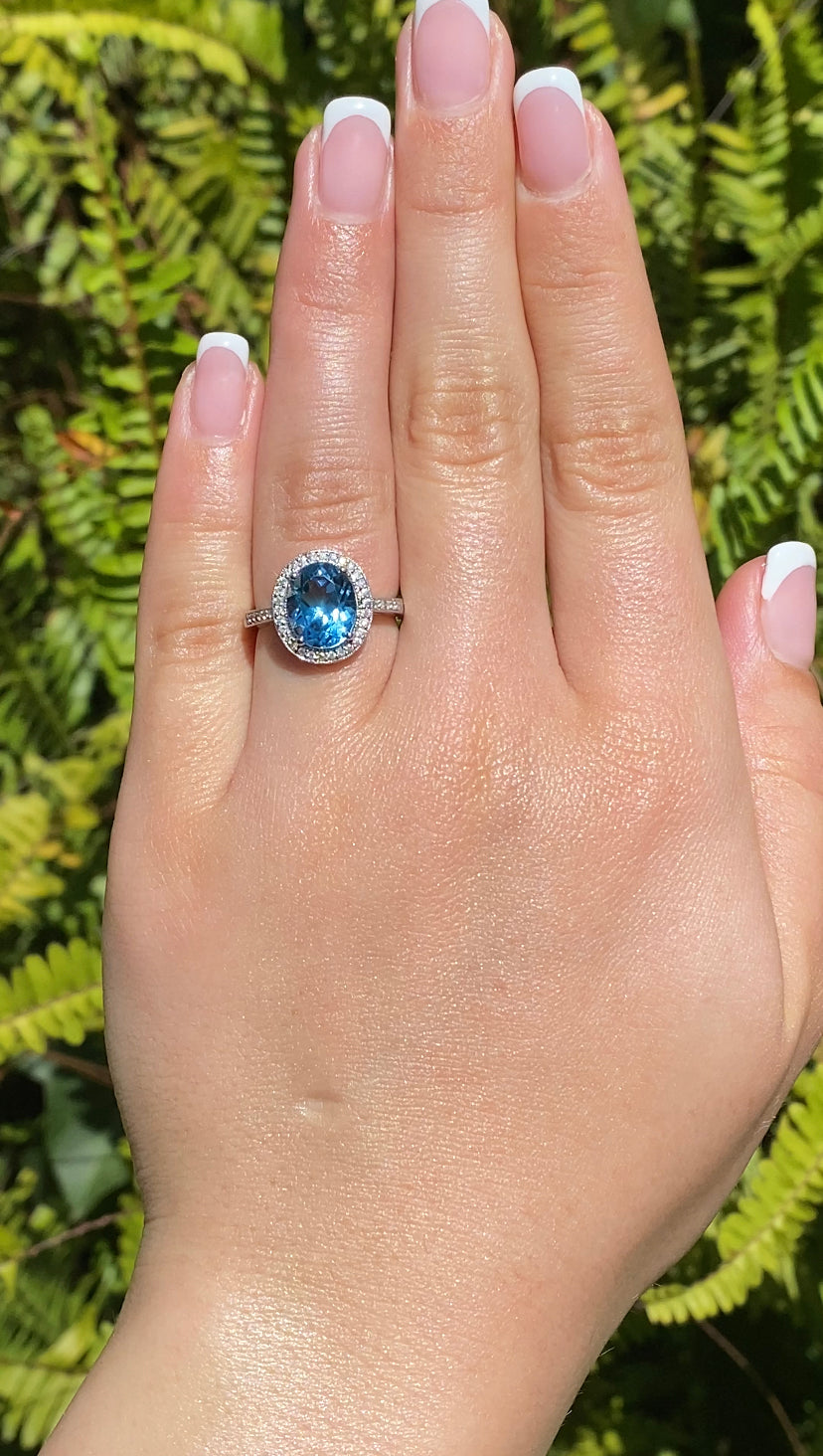 14K gold blue topaz and diamond ring.