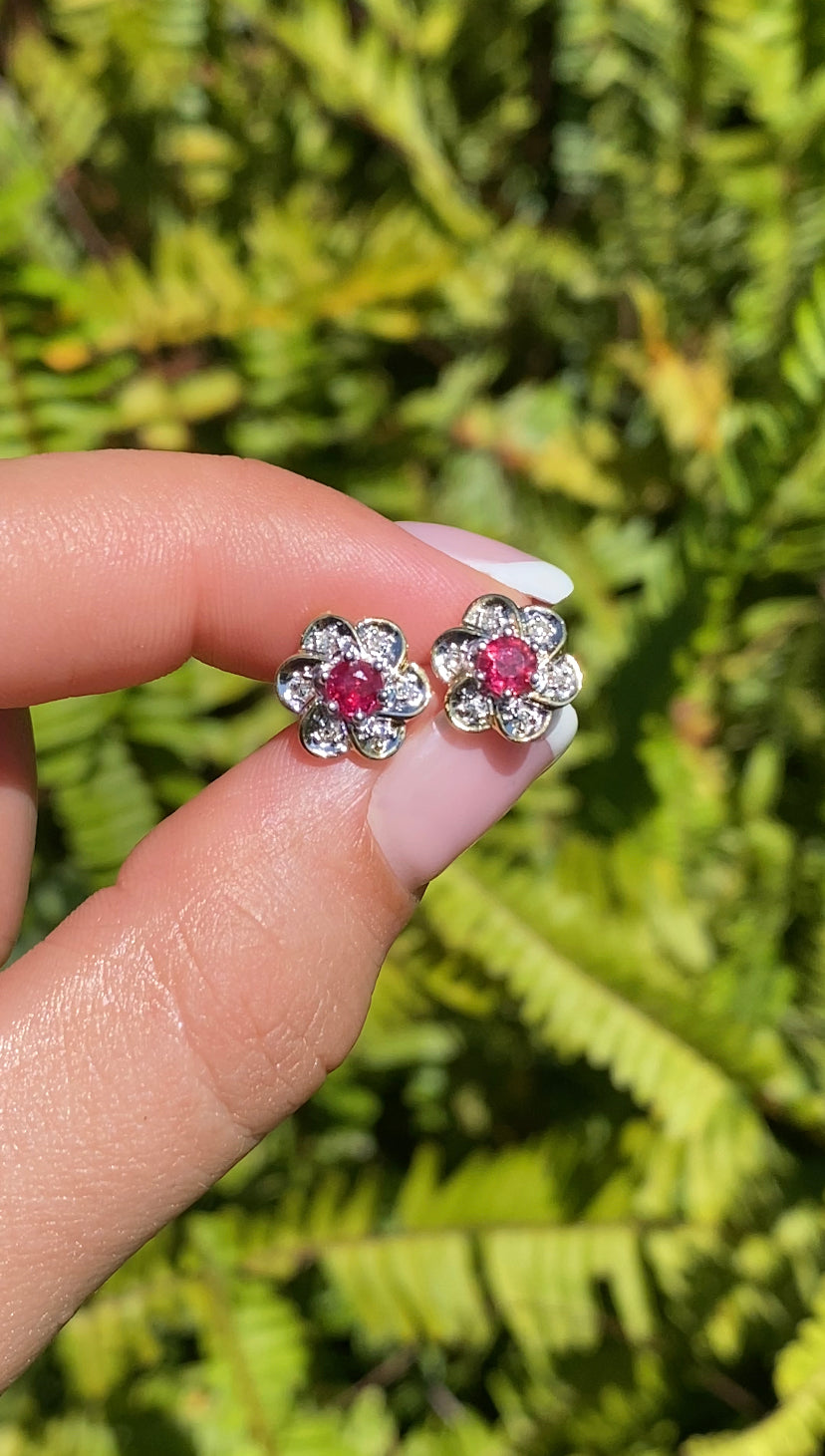 14K gold ruby and diamond flower earrings.