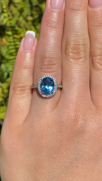 14K gold blue topaz and diamond ring.