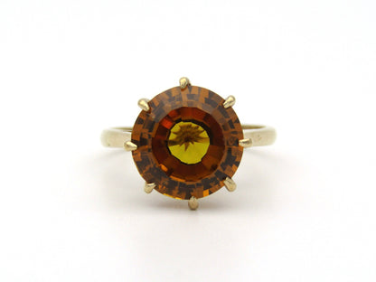 9K gold synthetic yellow sapphire ring.