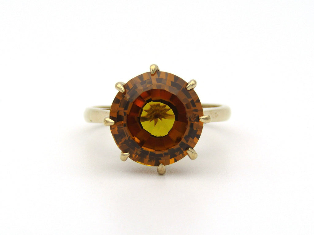 9K gold synthetic yellow sapphire ring.