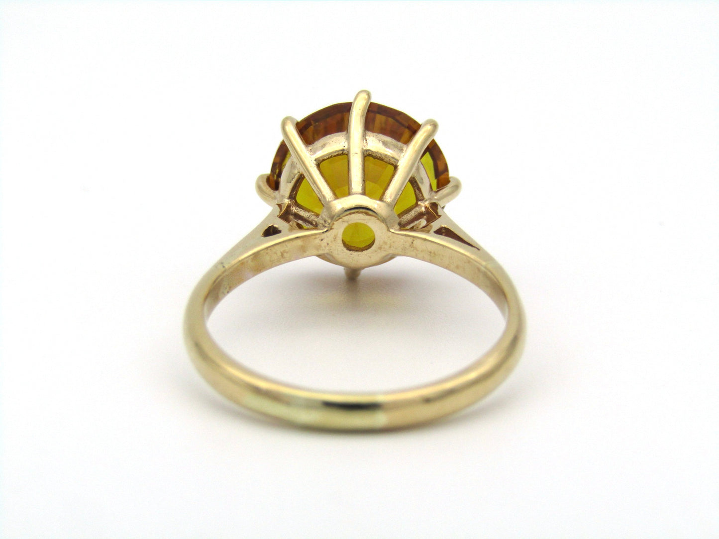 9K gold synthetic yellow sapphire ring.