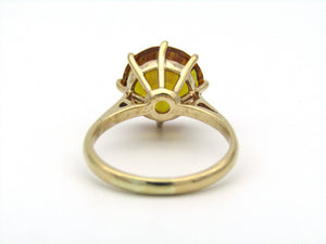 9K gold synthetic yellow sapphire ring.