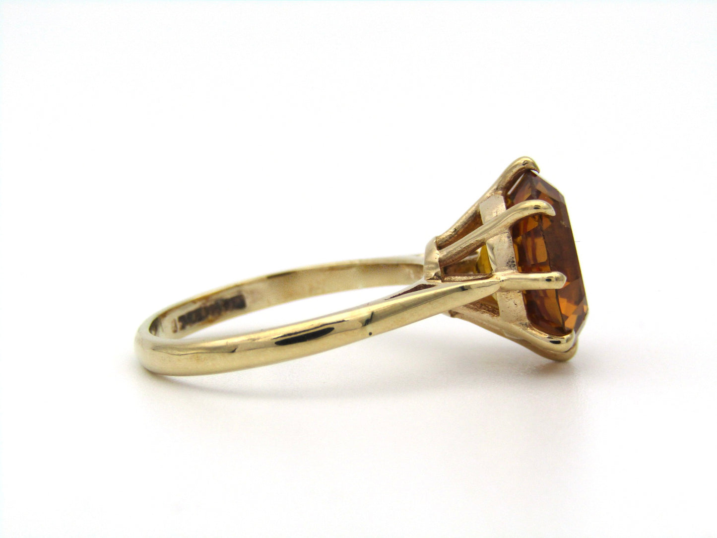 9K gold synthetic yellow sapphire ring.