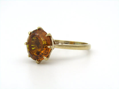 9K gold synthetic yellow sapphire ring.