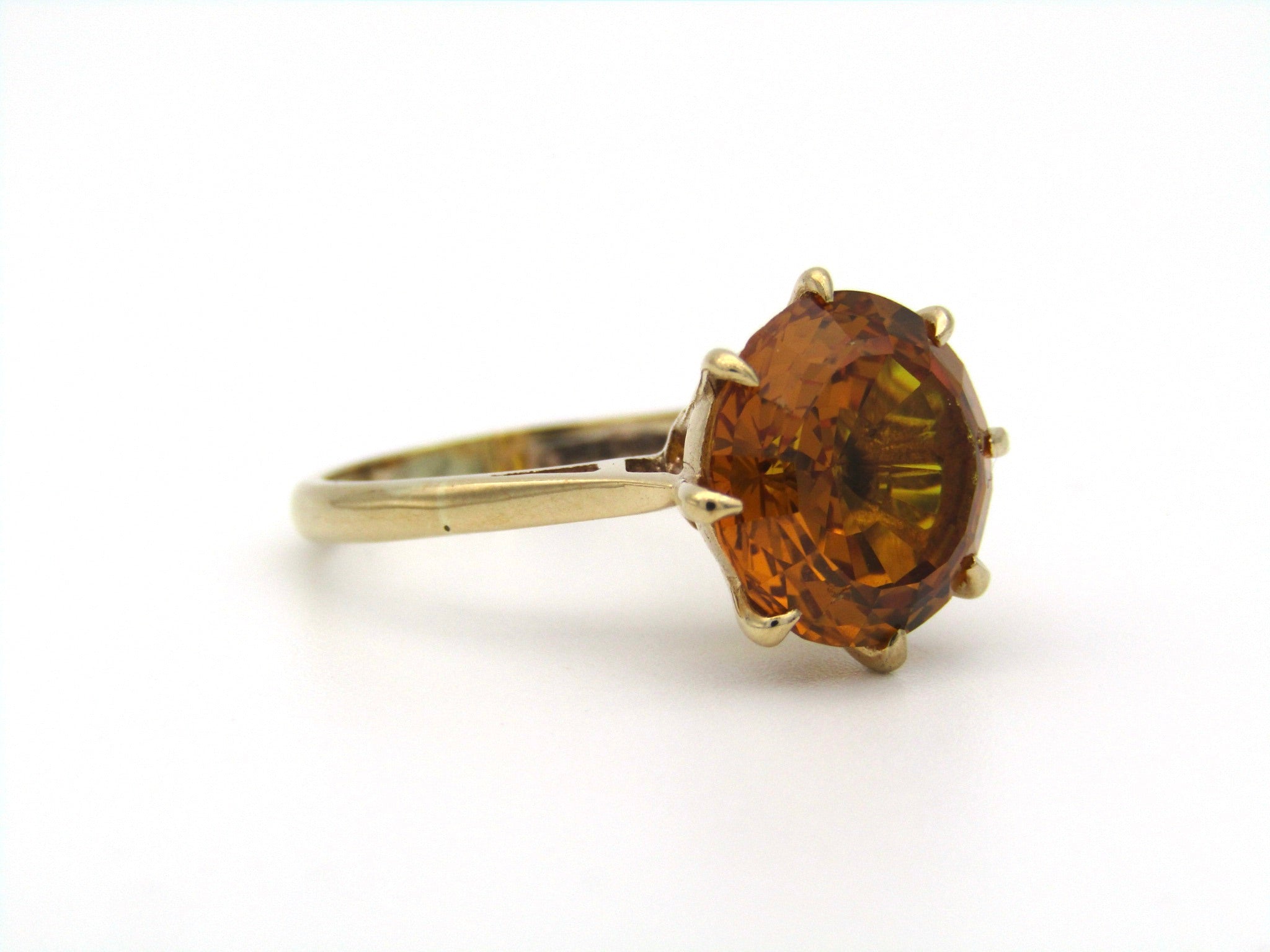 9K gold synthetic yellow sapphire ring.