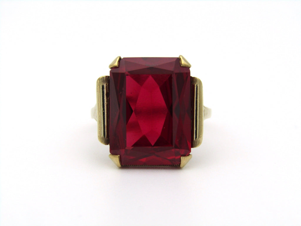9K gold synthetic ruby ring.
