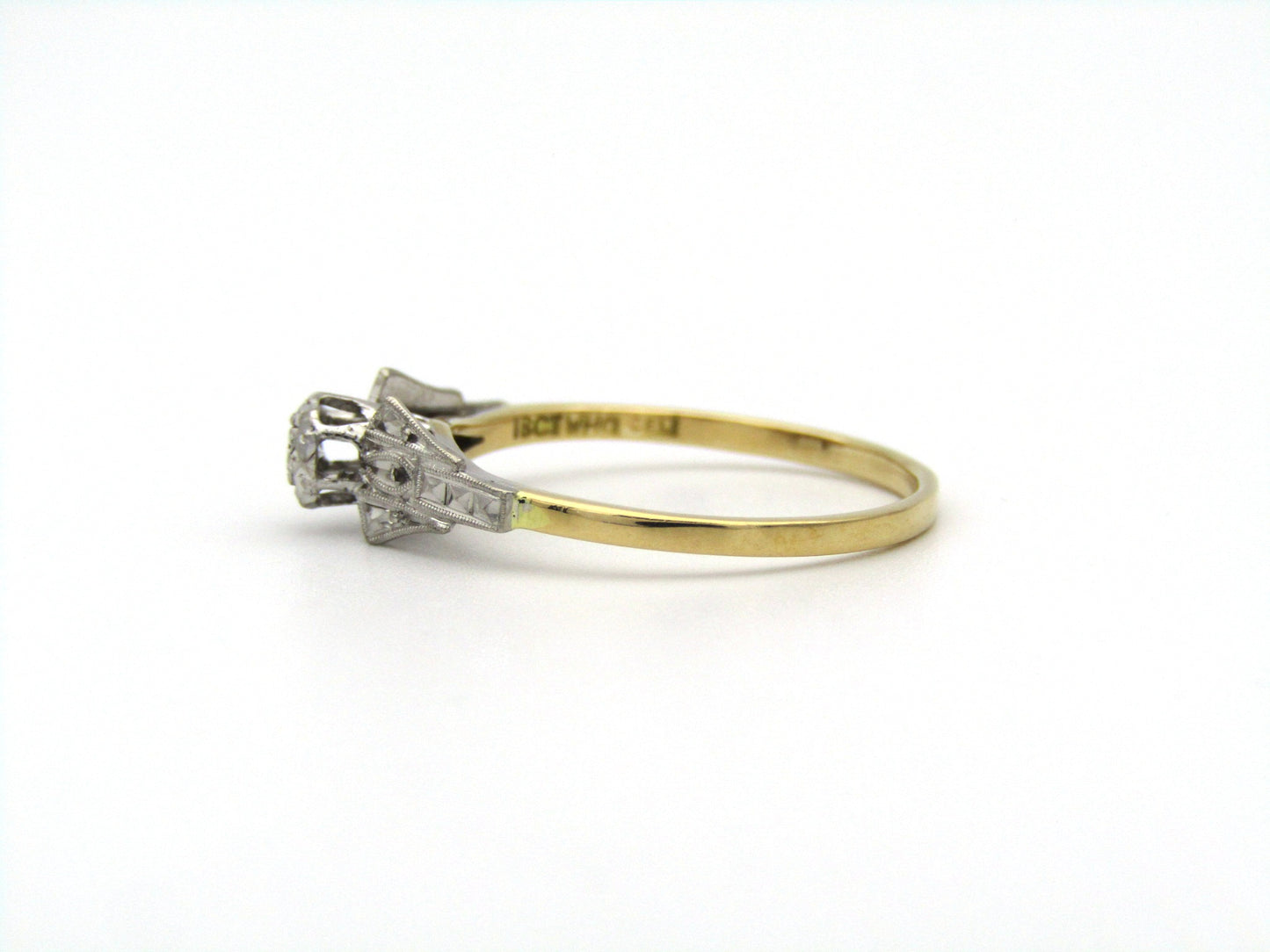 18K gold diamond ring.