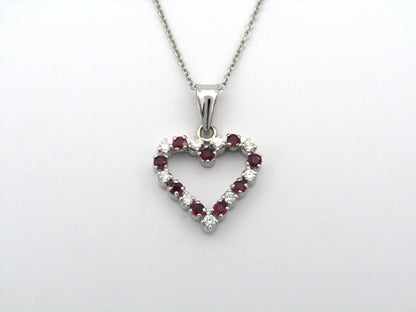 18K gold diamond and ruby heart pendant.