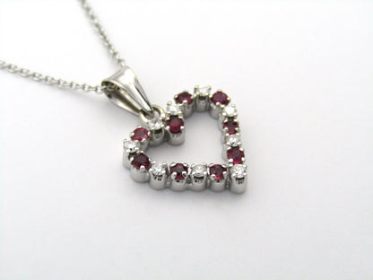 18K gold diamond and ruby heart pendant.