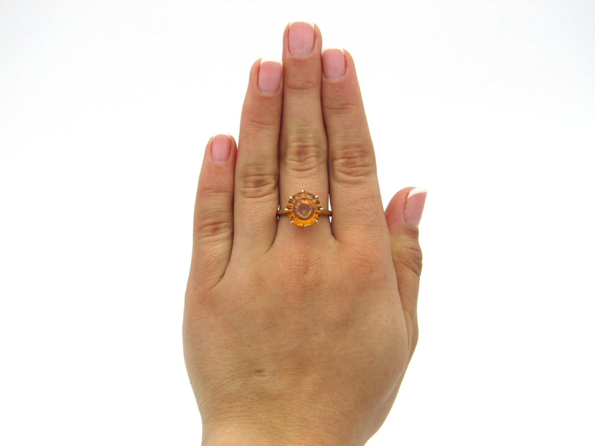 9K gold synthetic yellow sapphire ring.