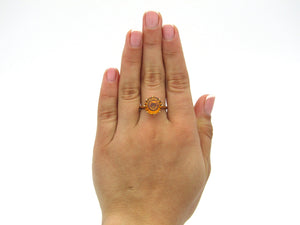 9K gold synthetic yellow sapphire ring.