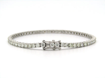 18K gold diamond tennis bracelet.