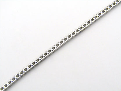 18K gold diamond tennis bracelet.