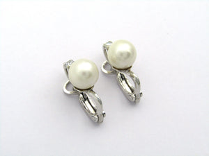 18K gold cultured pearl and diamond earrings.