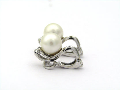 18K gold cultured pearl and diamond earrings.