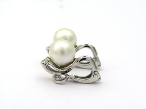 18K gold cultured pearl and diamond earrings.