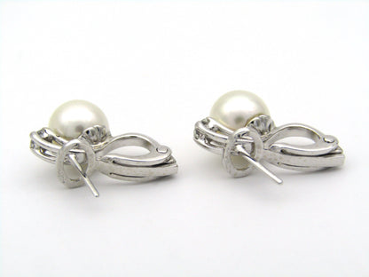 18K gold cultured pearl and diamond earrings.