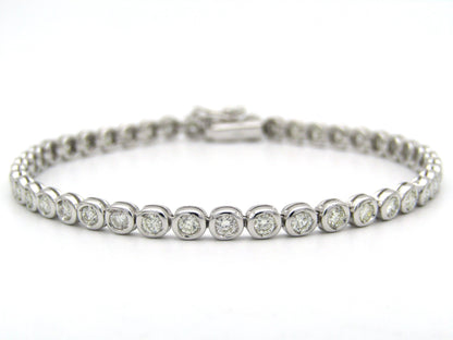 18K gold diamond tennis bracelet.