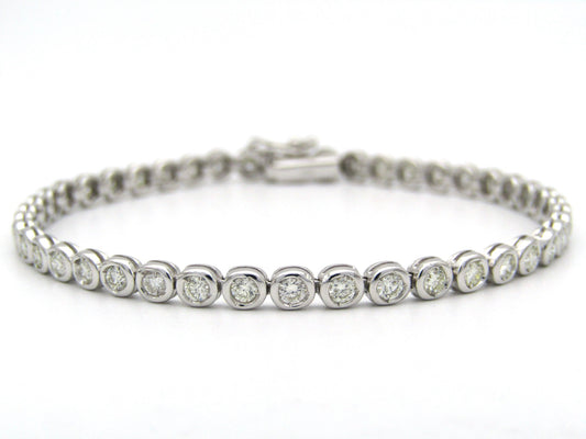 18K gold diamond tennis bracelet.