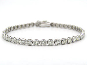 18K gold diamond tennis bracelet.