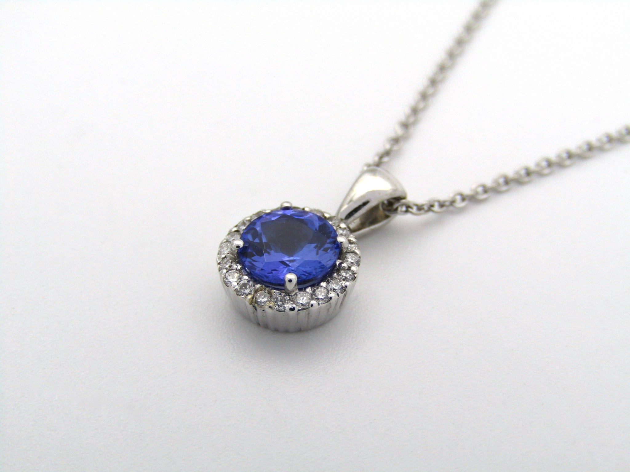 18K gold tanzanite and diamond pendant by Browns.