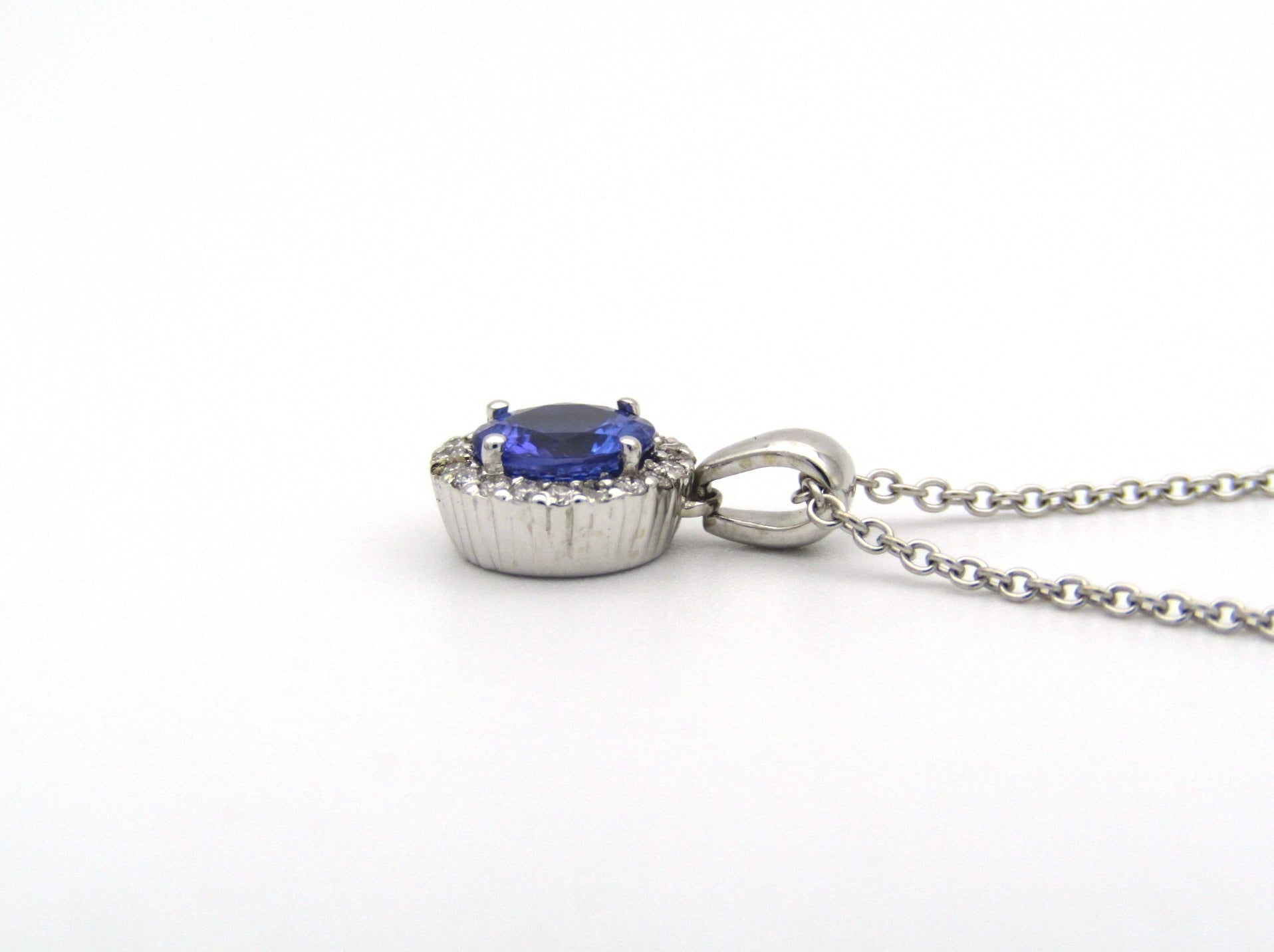 18K gold tanzanite and diamond pendant by Browns.