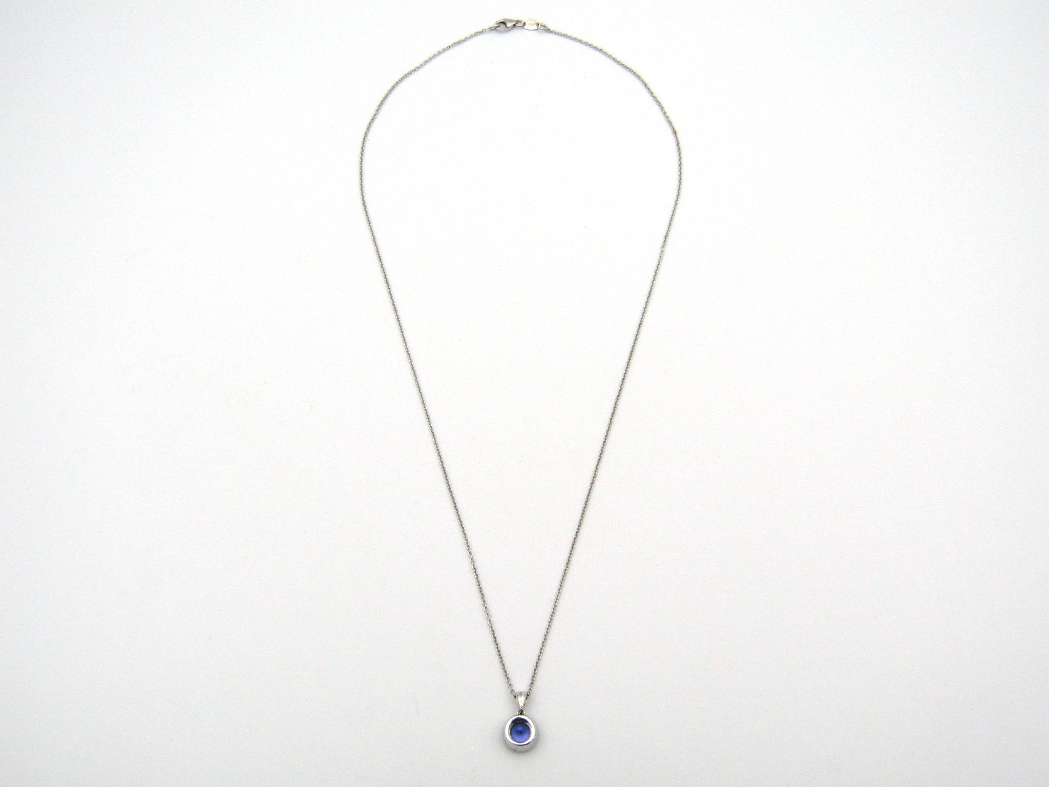 18K gold tanzanite and diamond pendant by Browns.