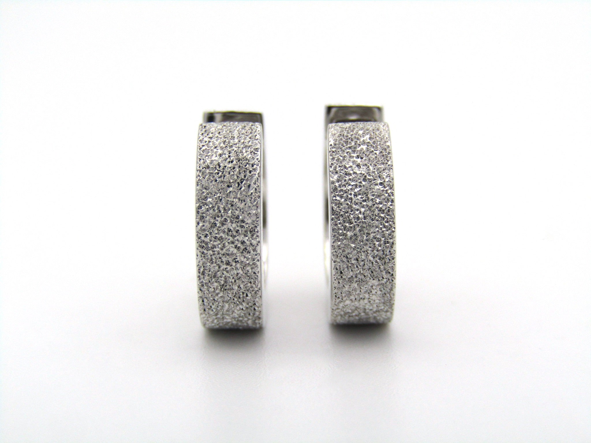 9K gold huggie earrings.