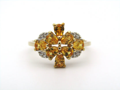 9K gold yellow sapphire and diamond ring.