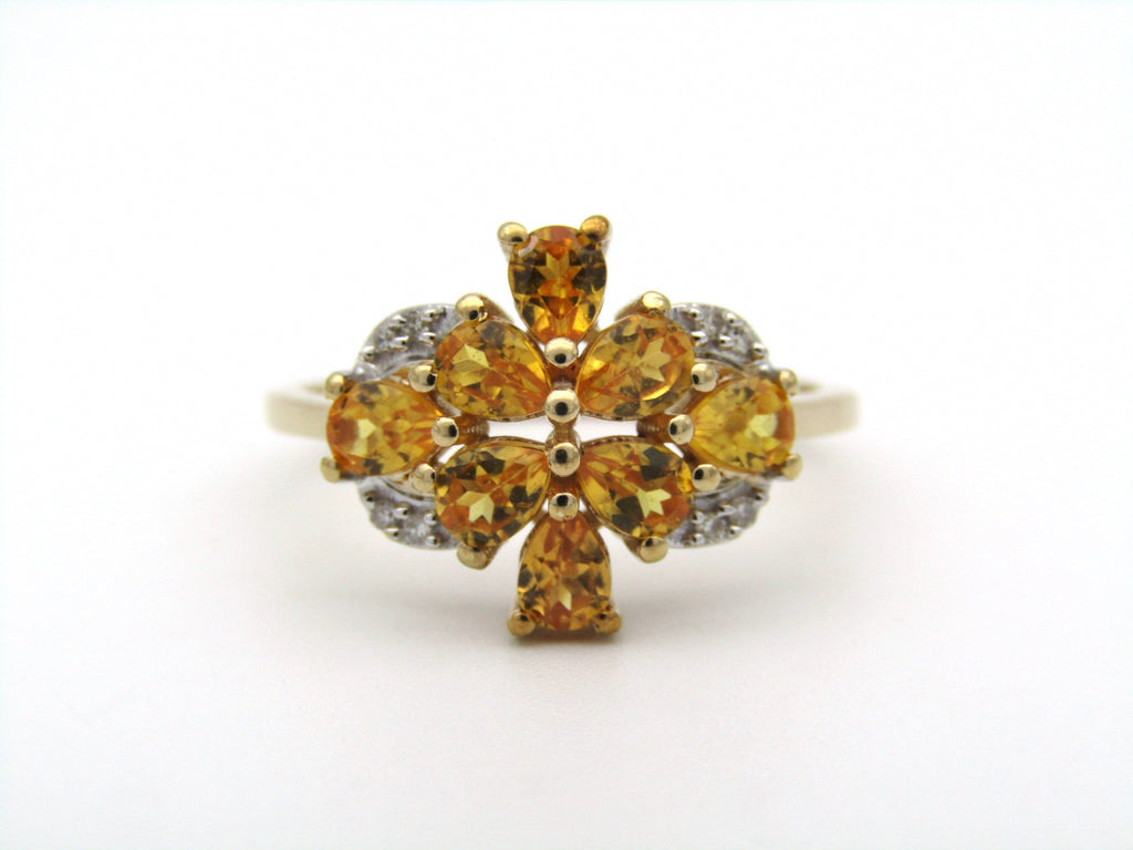 9K gold yellow sapphire and diamond ring.